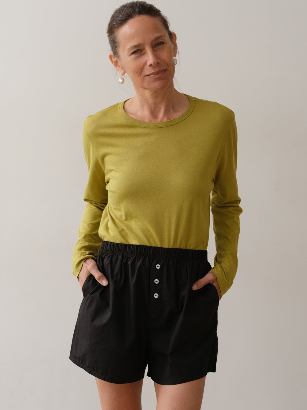 DONNI. Long-Sleeve Crew Neck Top in Olive